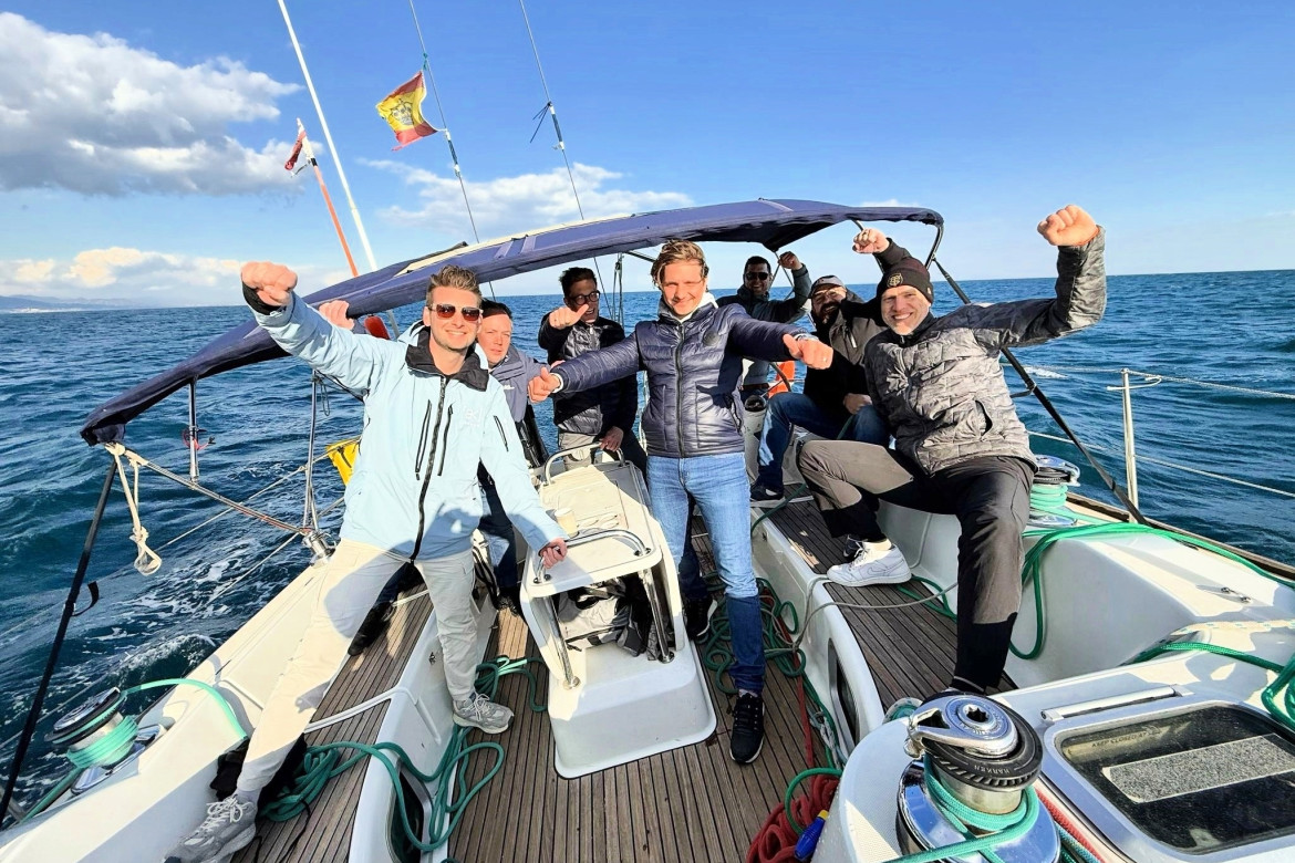 crew competing in a sailing regatta in Barcelona.