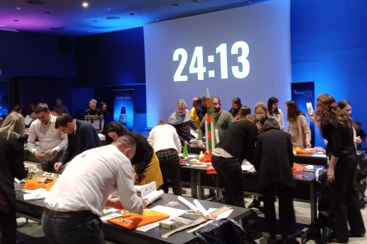 corporate group making model rockets with a countdown.