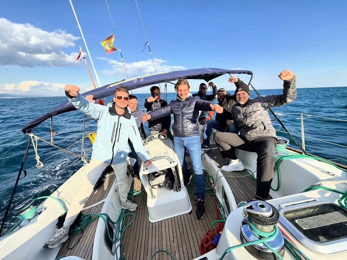 crew competing in a sailing regatta in Barcelona.