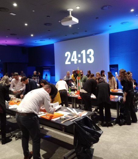 corporate group making model rockets with a countdown.